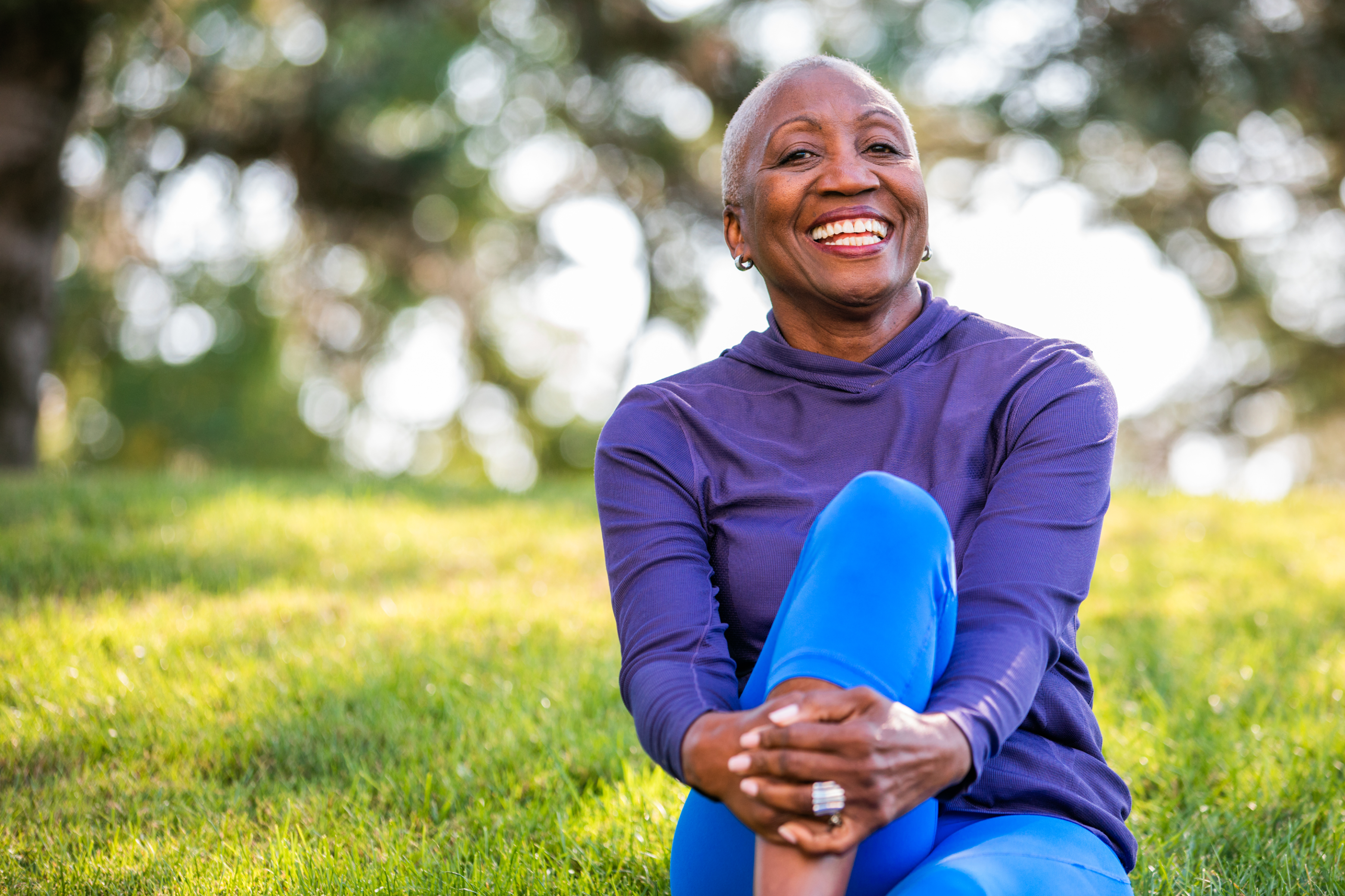 Senior in the park smiling and resting