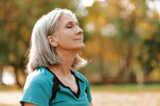 Senior outside breathing fresh air