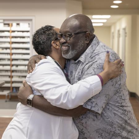 Dr. Gianni Neil and Patient